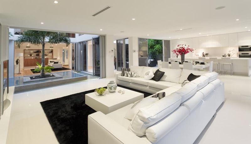 Modernise your character home by merging your kitchen and living room into a single space.